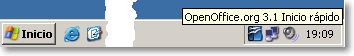 Barra de tareas de Windows con el icono de Inicio rápido de OpenOffice.org 3.1 junto al reloj